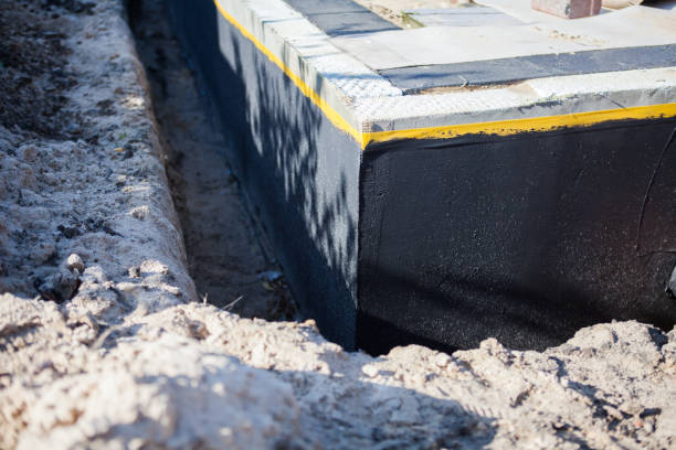 Professional Waterproofing technician working in Neopit, WI